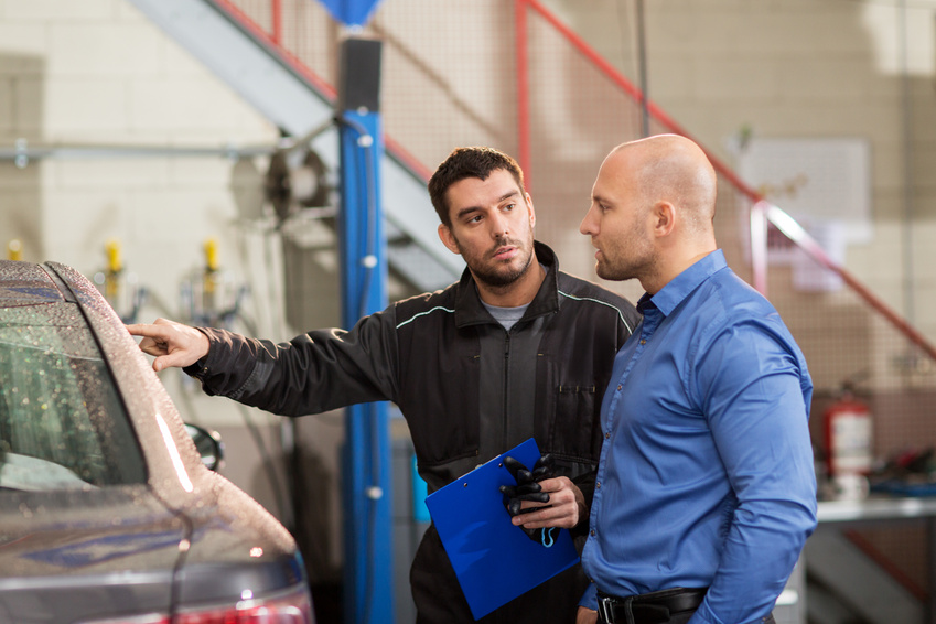 Auto Mechanic and Customer at Car Shop